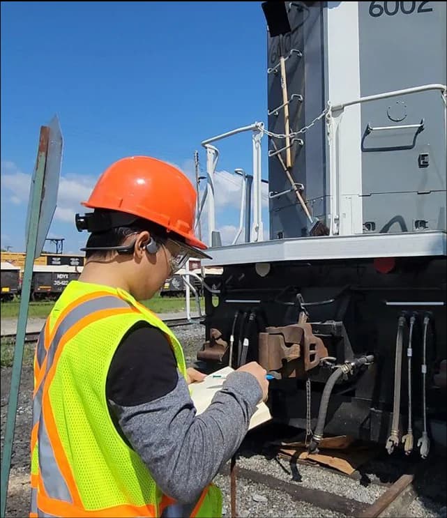 Railway inspector using digital monitoring technology for track infrastructure assessment